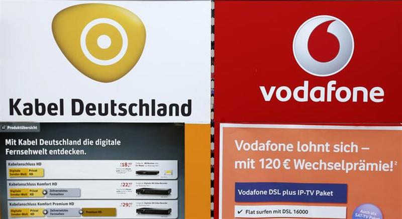 An advertising billboard of Germany's biggest cable operator Kabel Deutschland and mobile operator Vodafone is pictured in a shop in Berlin