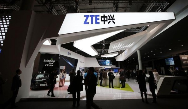 Visitors attend the ZTE stand at the Mobile World Congress in Barcelona