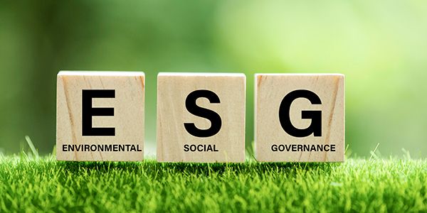 words ESG on a wood block and Future environmental conservation and sustainable ESG modernization development by using the technology of renewable resources to reduce pollution and carbon emission.